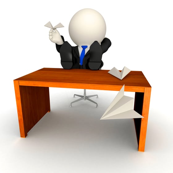3D business man on his desk wasting time - isolated over a white background