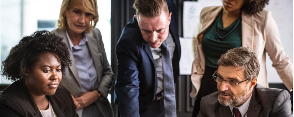 business guy showing business women something