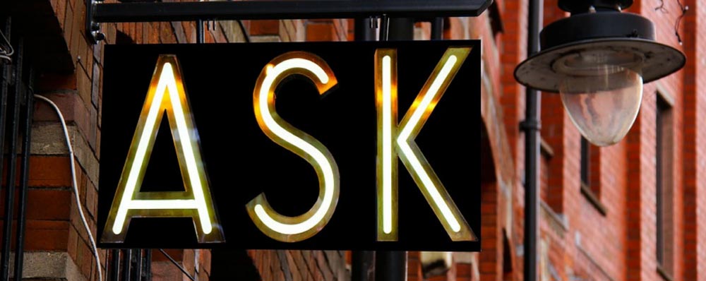 Neon sign that says ask