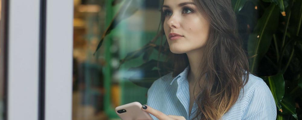 pretty woman holding cellphone