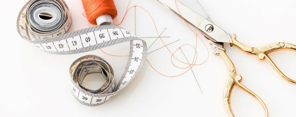 scissors thread and tape measure