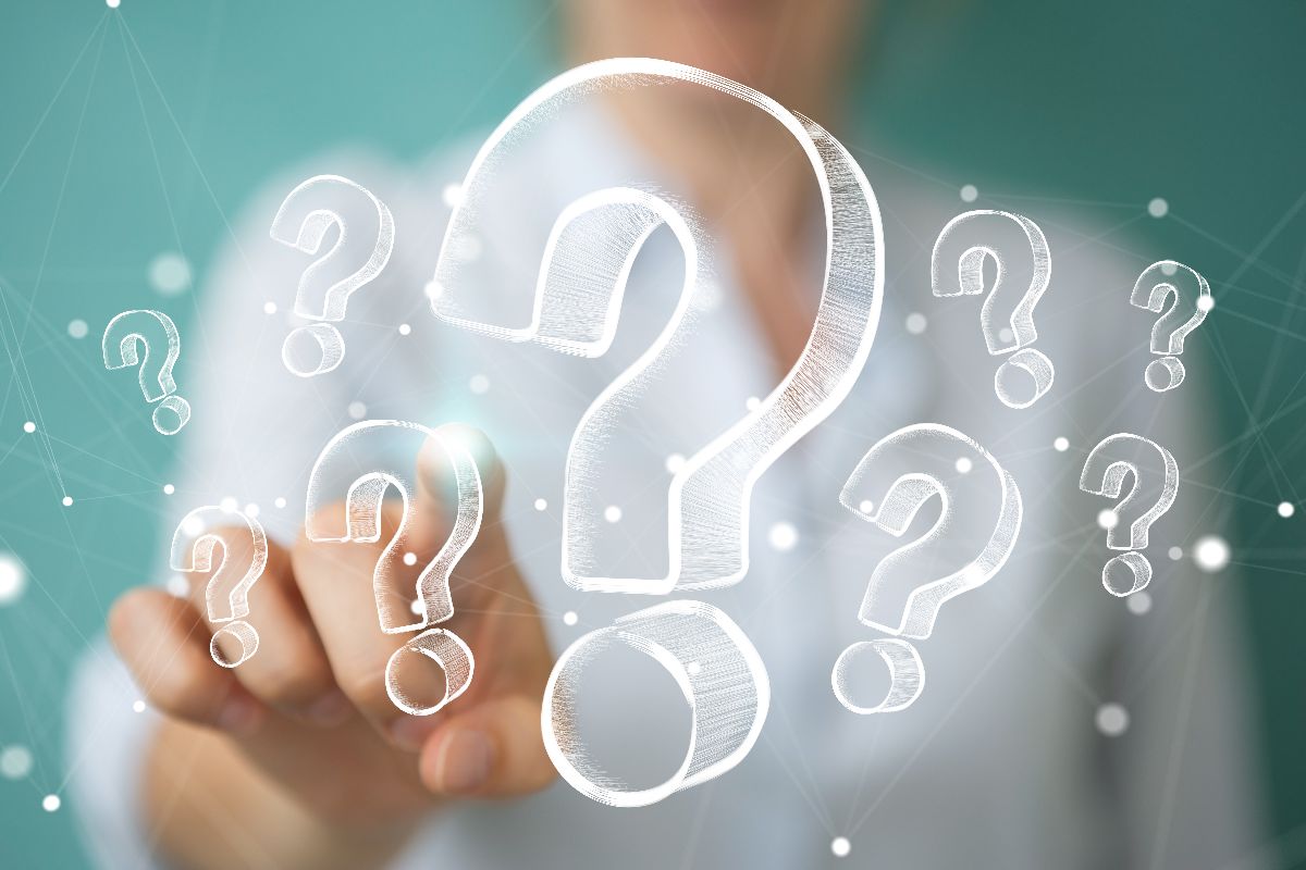 person pointing to question mark icon