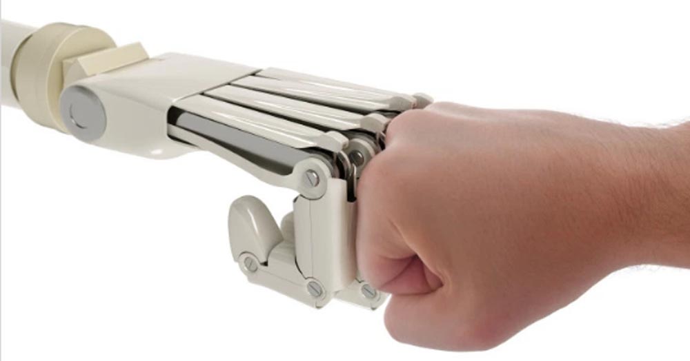 robot and human fist bumping