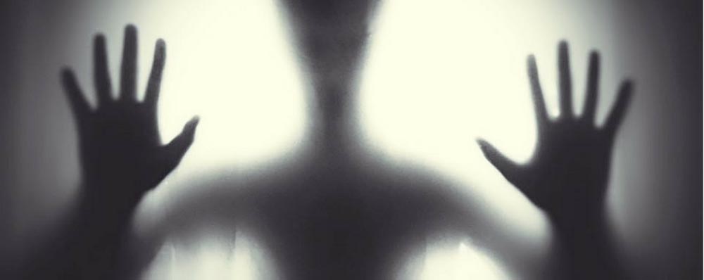 alien behind blurry glass