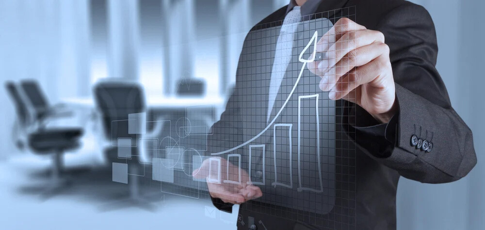 businessman hand working with new modern computer and business strategy as concept